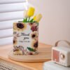 Sunflower book vase styled on a table