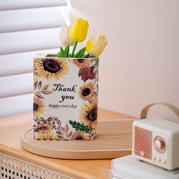 Sunflower book vase styled on a table
