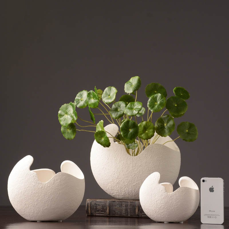 Organic white ceramic vases in three sizes