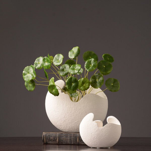 Organic white vase forms in a styled arrangement