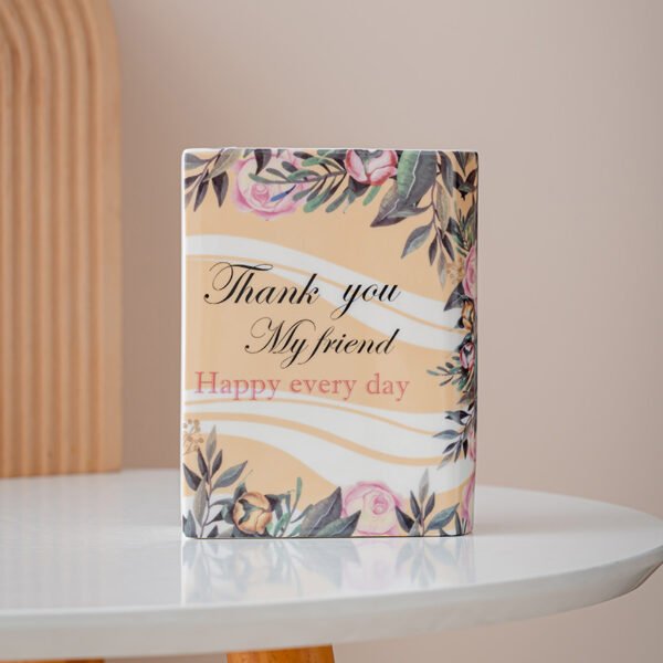 Small floral ceramic book vase